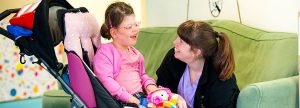 A child and carer at Chestnut Tree House