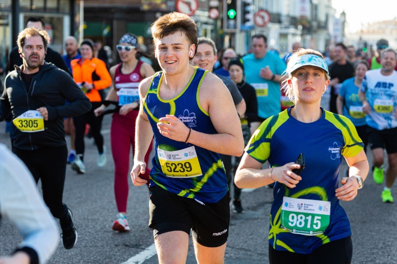 Two runners running for Alzheimer's Society at Brighton Half 2022